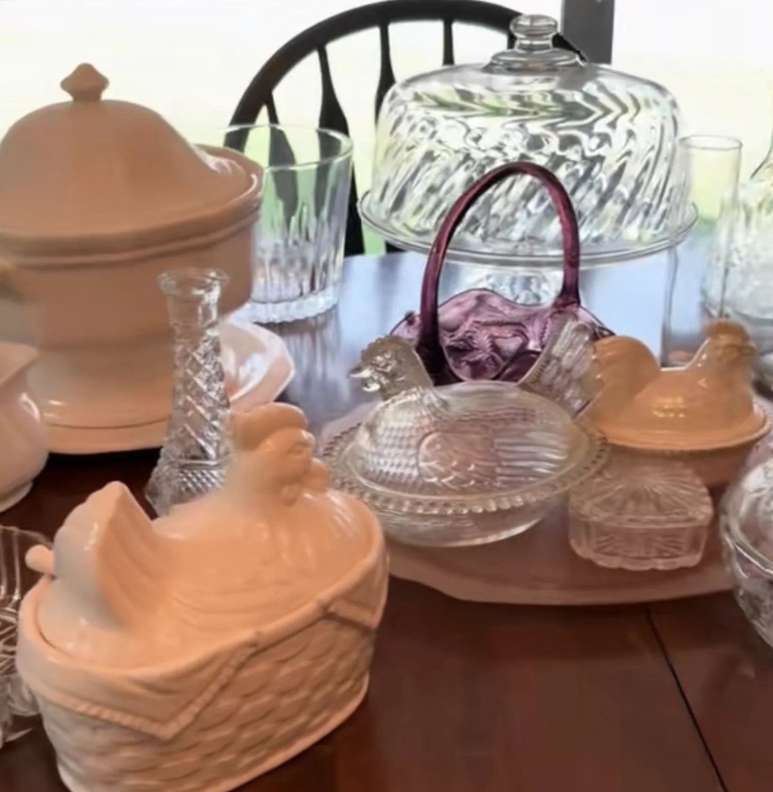 Peach ceramic serving pieces and clear glassware from a Friendswood estate sale