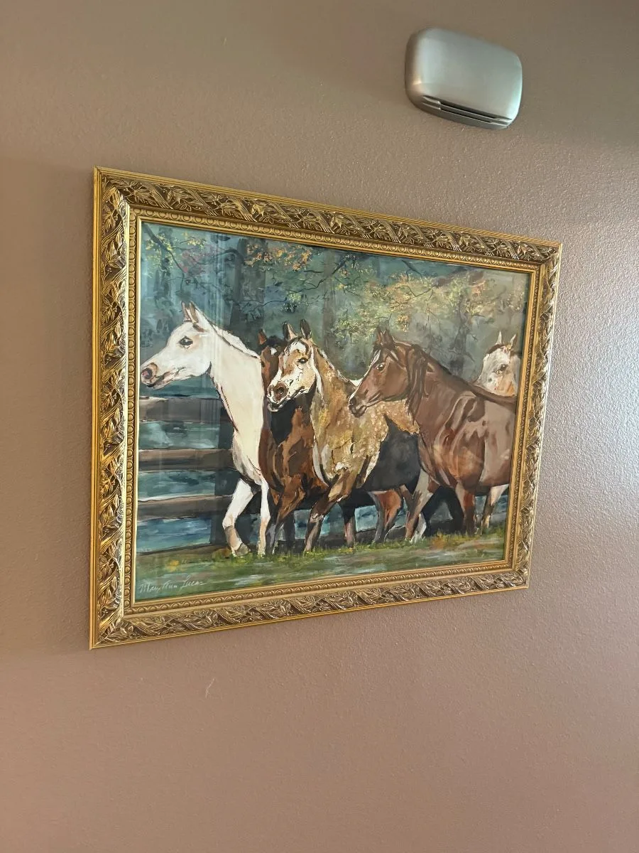 Framed horse artwork from a Friendswood estate sale