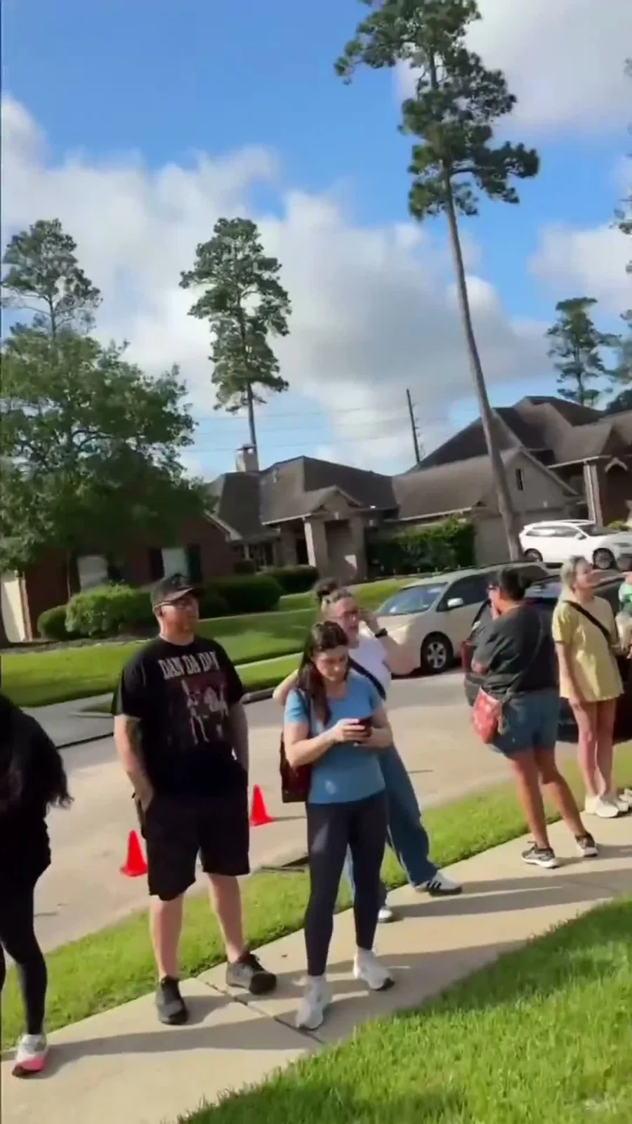 A line of shoppers outside a busy J and M estate sale