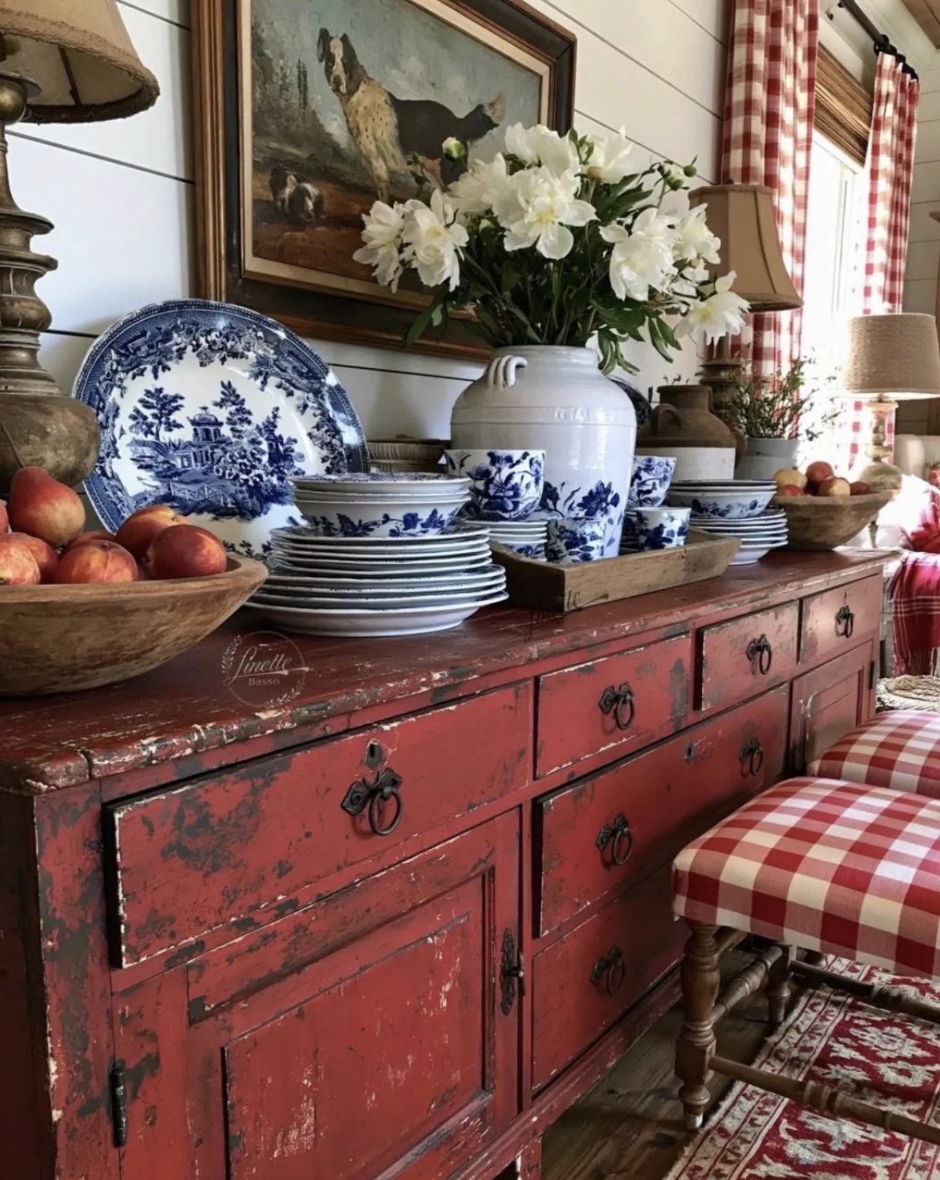 Blue-and-white china arranged on a red sideboard for an online estate auction