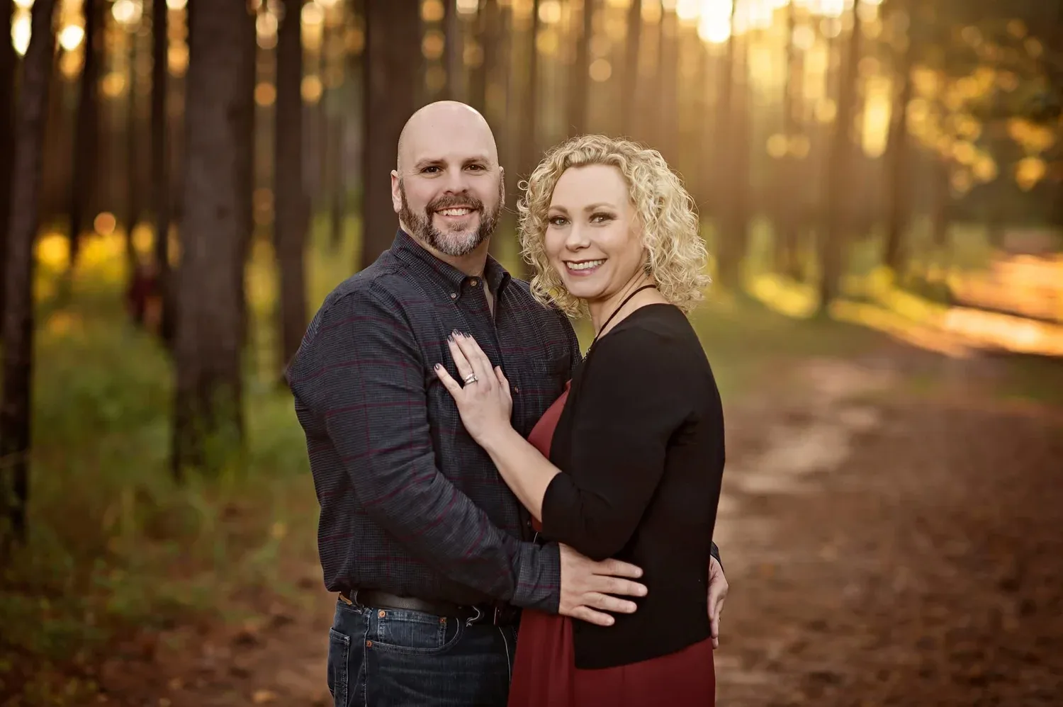 The smiling couple behind the family-owned J and M Estate Sales team