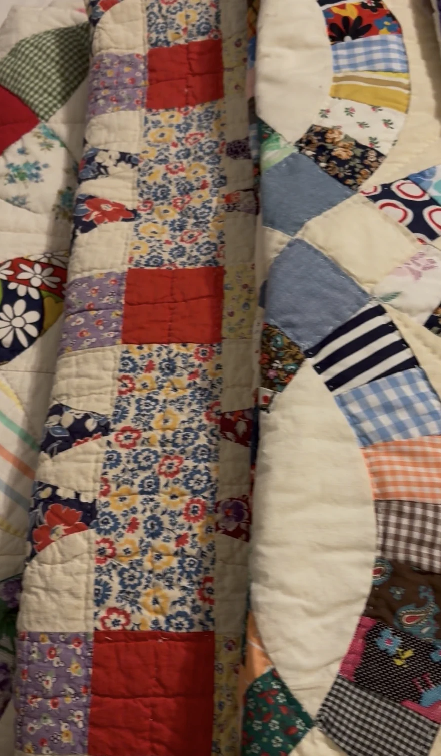 Colorful handmade patchwork quilts from a J and M estate sale